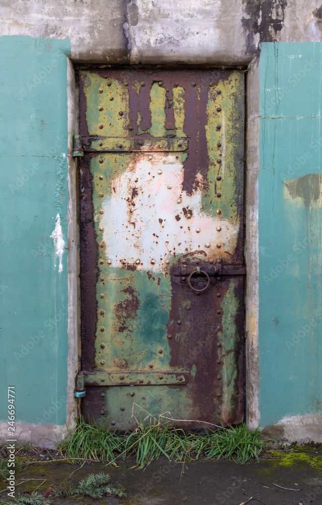 Rusting steel door at Fort Worden - an abandonded WWI era military installation Rusting steel door at Fort Worden - an abandonded WWI era military installation