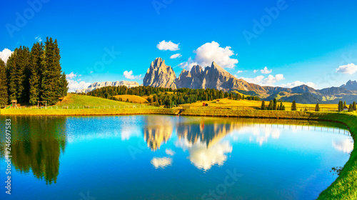 Lake and mountains, Alpe di Siusi or Seiser Alm, Dolomites Alps, Italy. photo