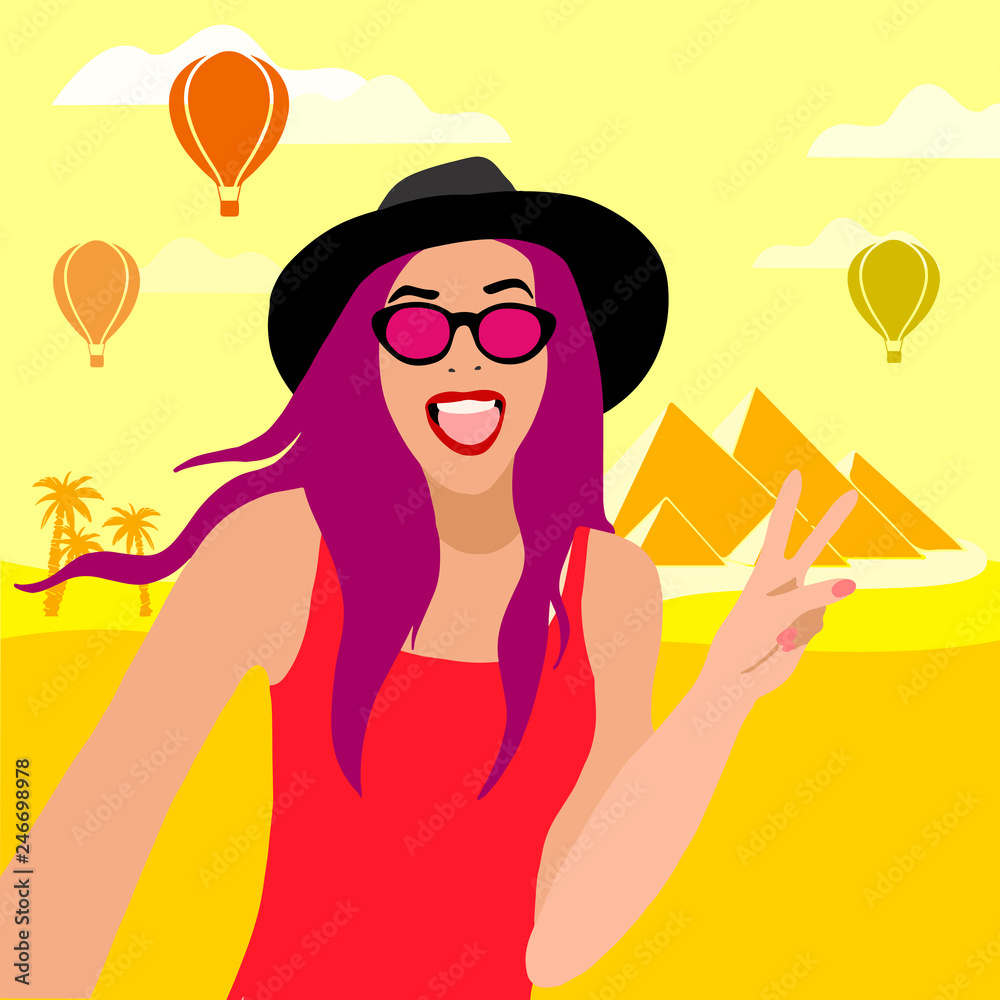girl in glasses and a hat travels in Egypt. selfie on the background of the pyramids girl in glasses and a hat travels in Egypt. selfie on the background of the pyramids