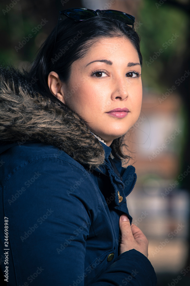 portrait of brunette girl in the park portrait of brunette girl in the park