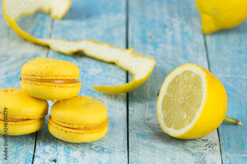 Yellow macarons and fresh lemons