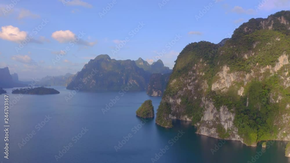 Aerial view of beautiful mountains and natural attractions in Cheow Lan Lake,Khao Sok National Park, Surat Thani Province,Thailand. Beauty,power of nature,wanderlust and amazing destination concept. Aerial view of beautiful mountains and natural attractions in Cheow Lan Lake,Khao Sok National Park, Surat Thani Province,Thailand. Beauty,power of nature,wanderlust and amazing destination concept.