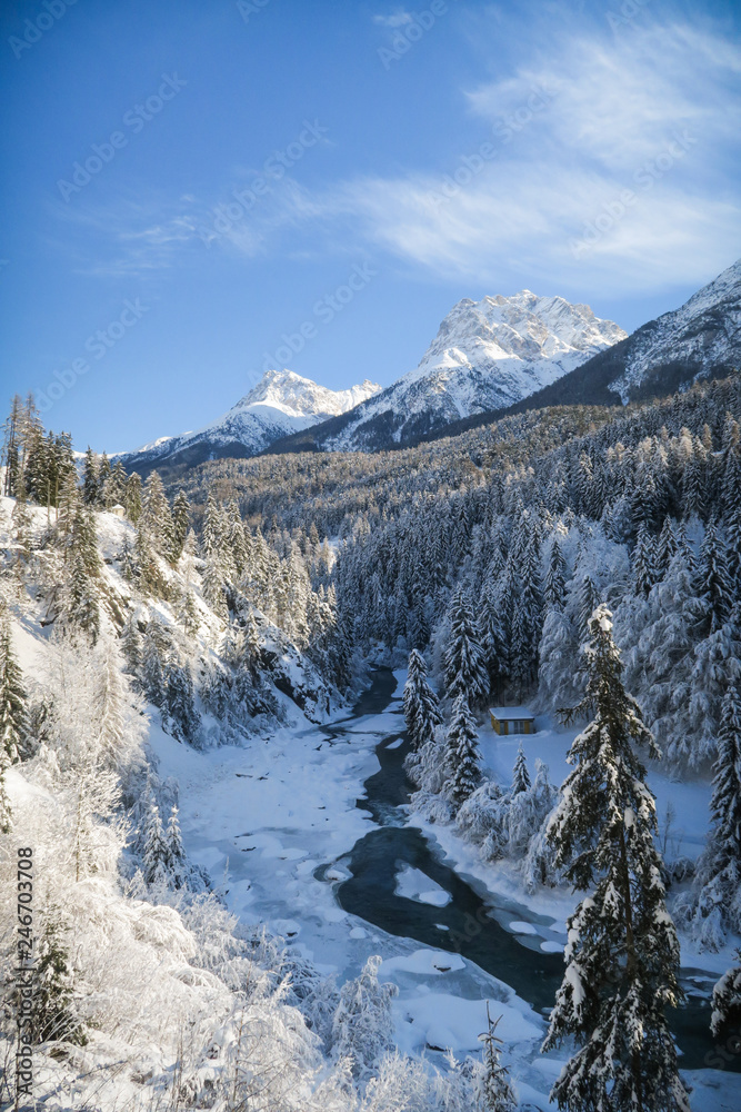Winter wonderland with river in Switzerland