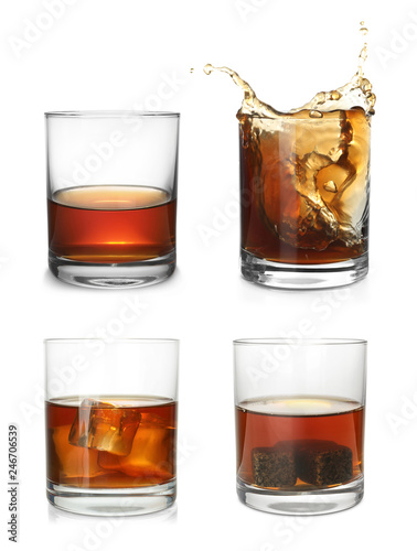 Set of glasses with expensive whiskey on white background