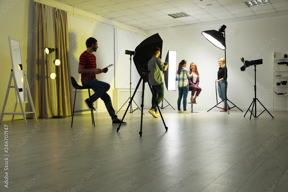 Obraz premium Photo studio with professional equipment and team of workers