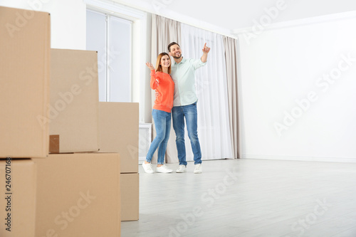 Happy couple and moving boxes in their new house © New Africa