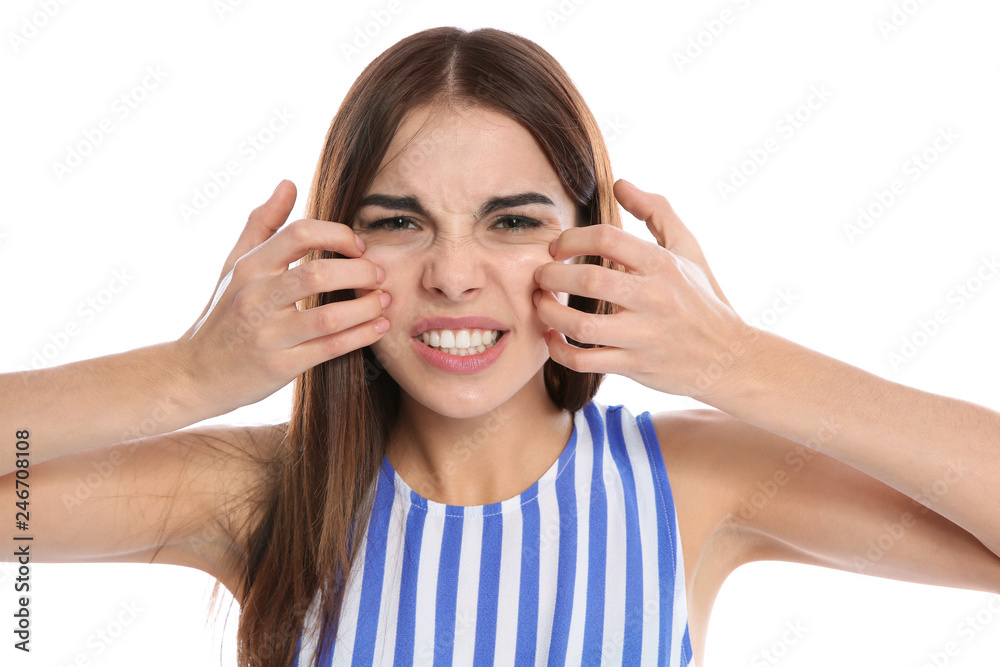 Young woman scratching face on white background. Annoying itch Young woman scratching face on white background. Annoying itch