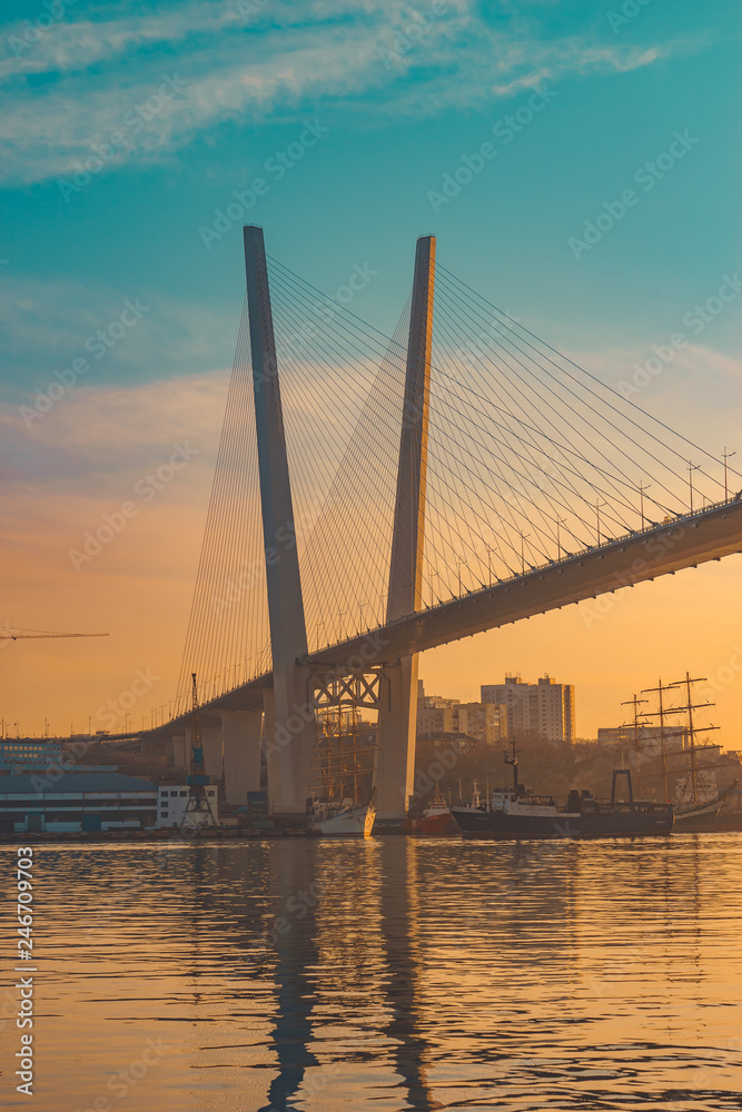 Fototapeta premium Vertical landscape overlooking the Golden bridge at sunset.