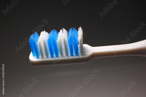 New toothbrush for brushing your teeth on a dark background