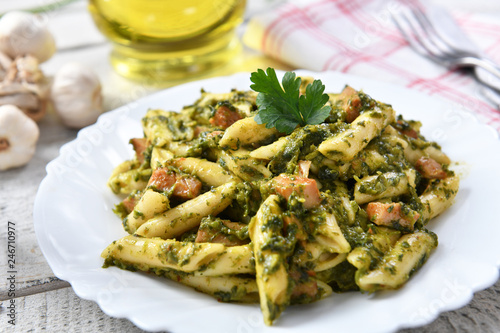 Penne pasta with spinach and meat