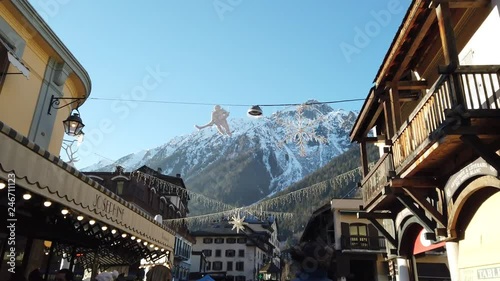 Mountain view from the centre of Chamonix city in France during a sunny day photo