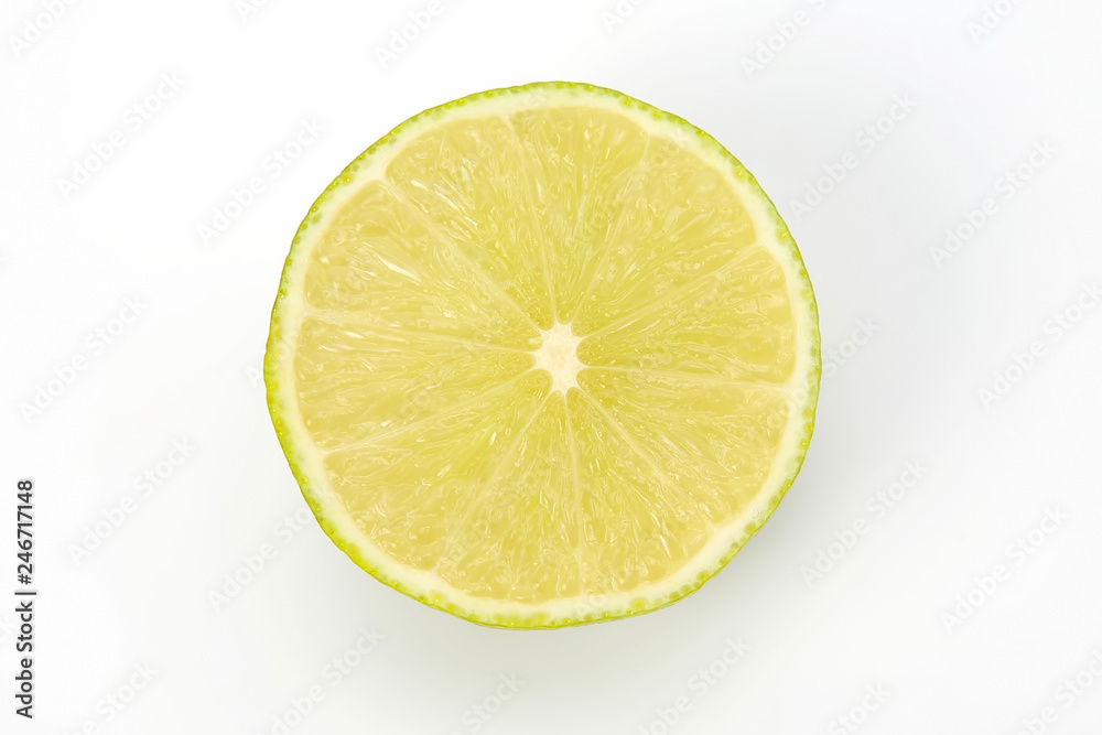 Cut citrus fruit of green lemon on white background