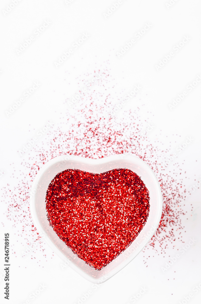Heart shape made of red glitter.