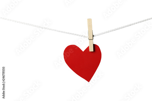 Red paper hearts hanging on the rope isolated on white background.