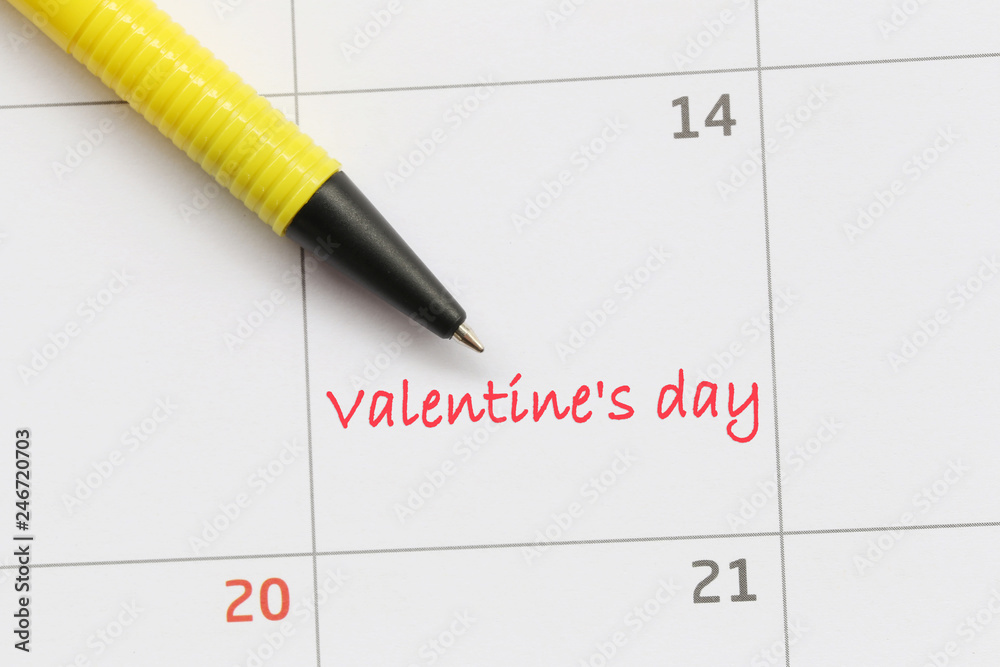 Yellow pen pointing to the letter number 14 of valentine's day. Yellow pen pointing to the letter number 14 of valentine's day.
