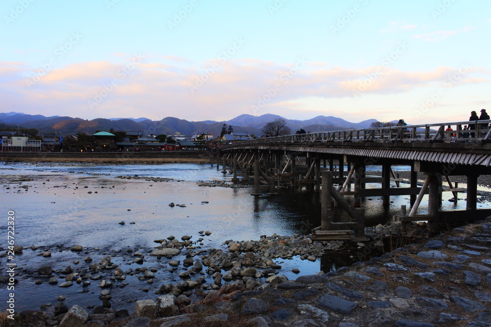 the beautiful river view with a bridge in Arashiyama, Kyoto, Japan the beautiful river view with a bridge in Arashiyama, Kyoto, Japan