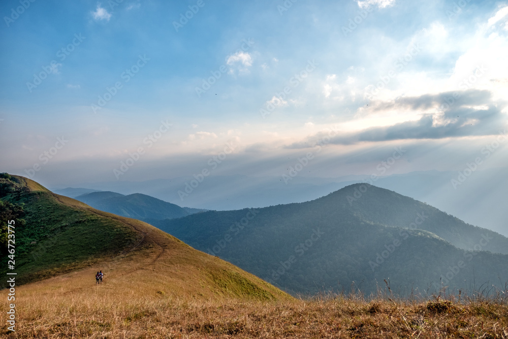 Three woman trekking on a high mountain with a beautiful nature scenic and blue sky background Three woman trekking on a high mountain with a beautiful nature scenic and blue sky background