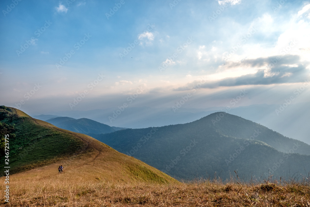 Three woman trekking on a high mountain with a beautiful nature scenic and blue sky background