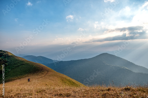 Three woman trekking on a high mountain with a beautiful nature scenic and blue sky background