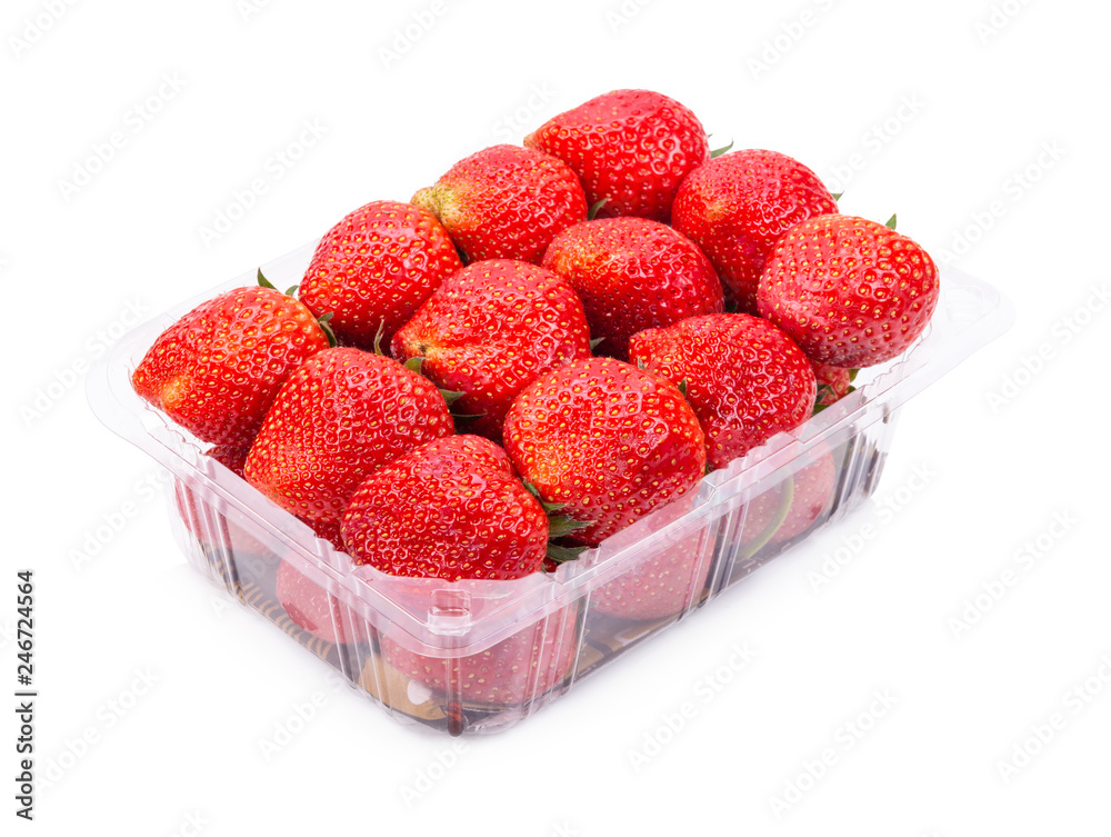 Ripe strawberries from the garden are packed in plastic boxes. Isolated on white background Ripe strawberries from the garden are packed in plastic boxes. Isolated on white background