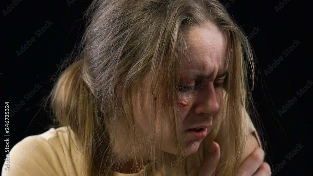Scared weak woman afraid of abuser, intimidated victim of domestic violence Scared weak woman afraid of abuser, intimidated victim of domestic violence