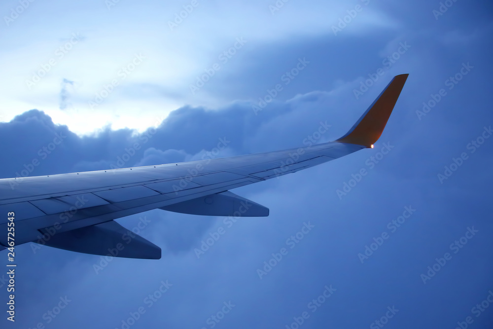 The wing of an airplane above the clouds The wing of an airplane above the clouds