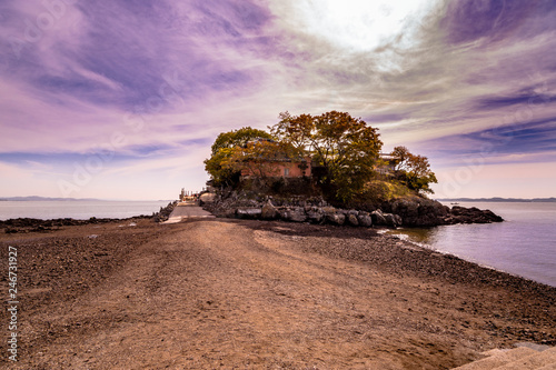 Ganworam Hermitage is connected to land by low tide photo