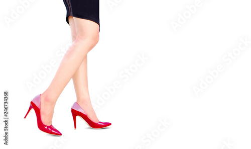 leg of woman beauty put on red high heels on isolated white background.Beauty and health concepts