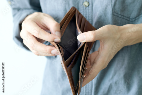 hand of businessman open pocket, no money in the business wallet, Financial concepts and expenditures,