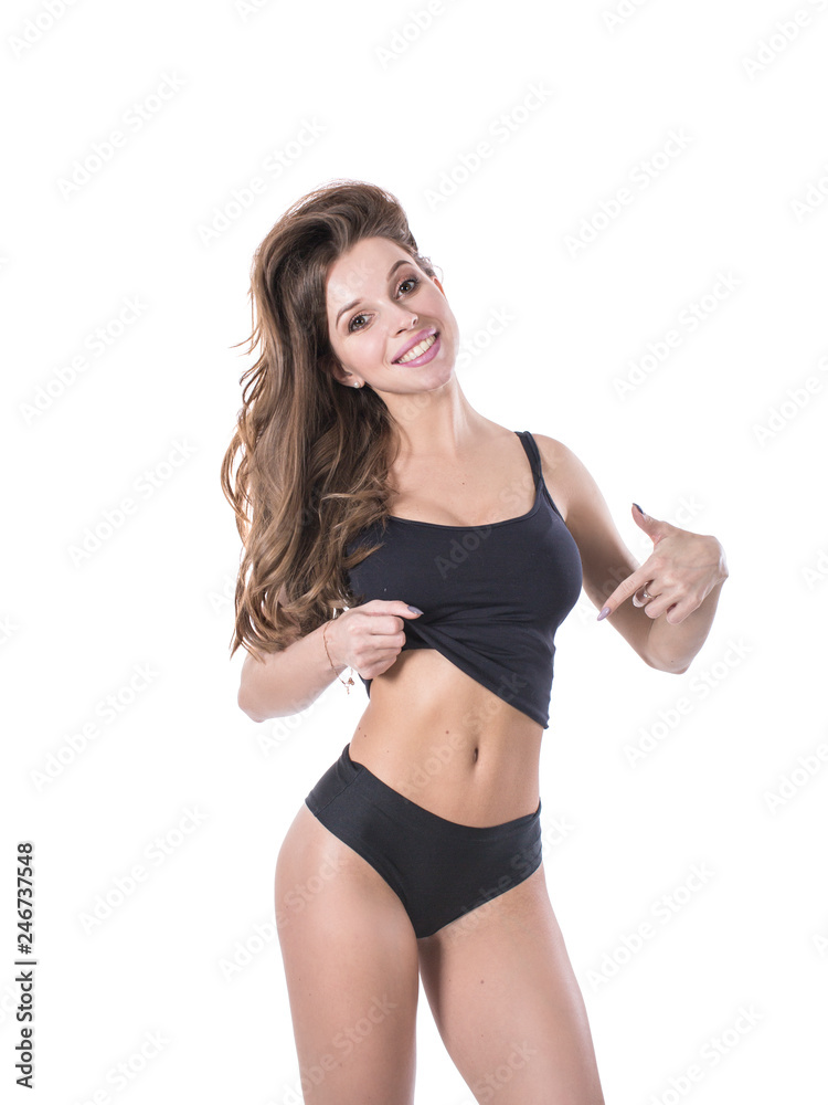 Portrait young woman smiling ans howing her slim waist. isolated on white background, model girl weight slim with cellulite or calories, health and wellness concept Portrait young woman smiling ans howing her slim waist. isolated on white background, model girl weight slim with cellulite or calories, health and wellness concept