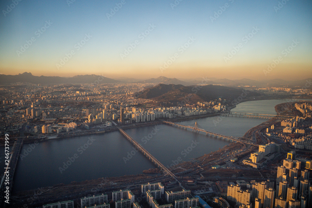 Aerial view cityscape of Seoul, South Korea. Aerial View Lotte tower at Jamsil. View of Seoul with river and mountain. Seoul downtown city skyline, Aerial view of Seoul