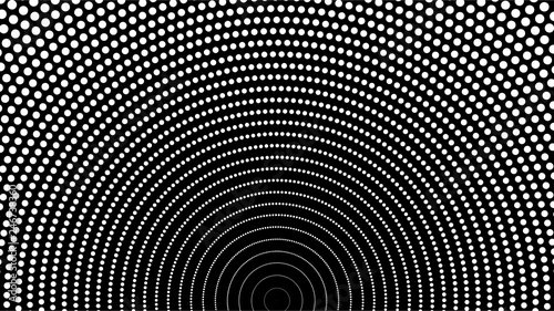 A small white spot arranged in a semi-circle on a black background