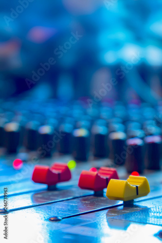 Slide the button to adjust the volume mixer of audio professionals. In the studio recording.