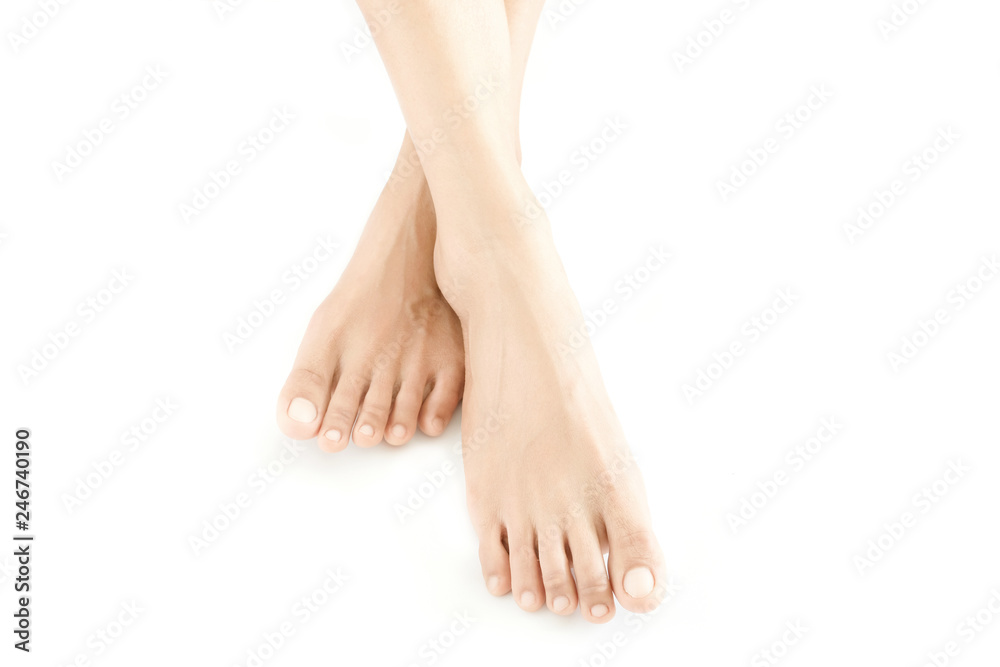 Beautiful female legs and feet on a white background.Concept beauty and hydration of the skin. Beautiful female legs and feet on a white background.Concept beauty and hydration of the skin.