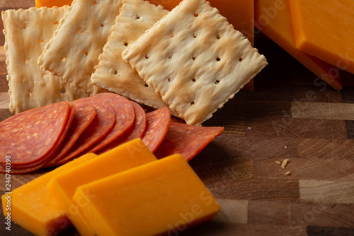 Cheese, Crackers, Pepperoni, and Hot Sauce