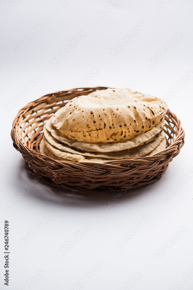 Chapati / Tava Roti also known as Indian bread or Fulka/phulka. Main ingredient of lunch/dinner in India/Pakistan. selective focus Chapati / Tava Roti also known as Indian bread or Fulka/phulka. Main ingredient of lunch/dinner in India/Pakistan. selective focus