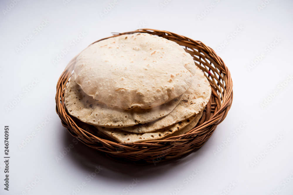 Chapati / Tava Roti also known as Indian bread or Fulka/phulka. Main ingredient of lunch/dinner in India/Pakistan. selective focus Chapati / Tava Roti also known as Indian bread or Fulka/phulka. Main ingredient of lunch/dinner in India/Pakistan. selective focus