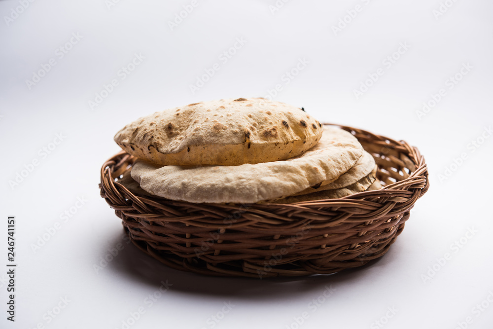 Chapati / Tava Roti also known as Indian bread or Fulka/phulka. Main ingredient of lunch/dinner in India/Pakistan. selective focus Chapati / Tava Roti also known as Indian bread or Fulka/phulka. Main ingredient of lunch/dinner in India/Pakistan. selective focus