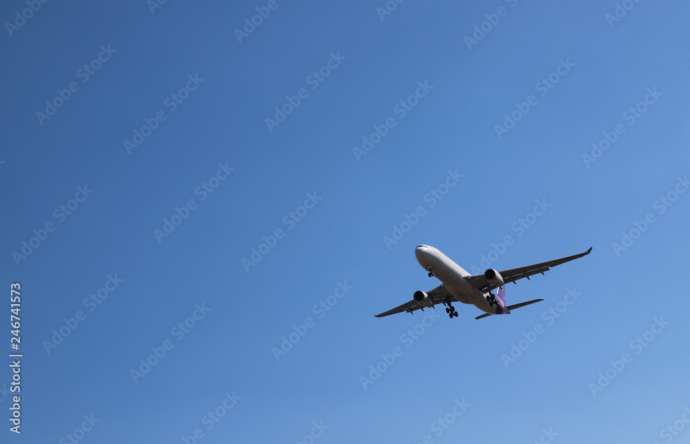 Scenery of airplane flying in clear blue sky of sunny day. The best way of transportation in modern world. Scenery of airplane flying in clear blue sky of sunny day. The best way of transportation in modern world.