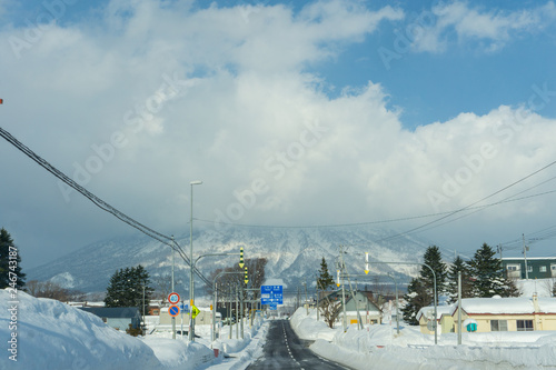 Beautiful Landscape view of long road with snow During winter season at Hokkaido, Japan