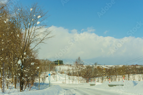 Beautiful Landscape view of long road with snow During winter season at Hokkaido, Japan