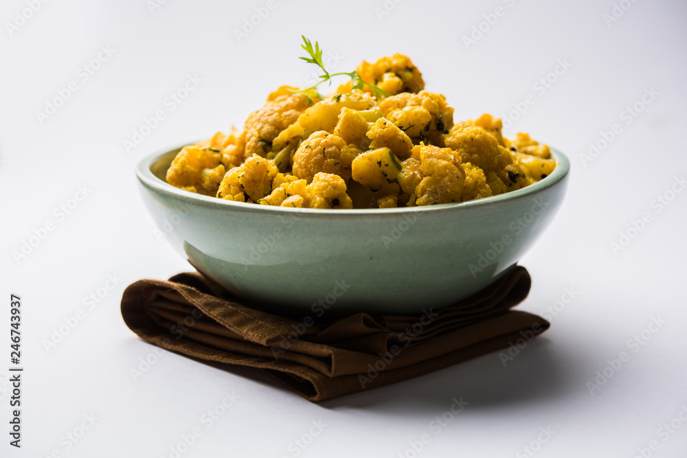 Dry Gobi Masala/ cauliflower Sabzi served in a bowl. selective focus Dry Gobi Masala/ cauliflower Sabzi served in a bowl. selective focus