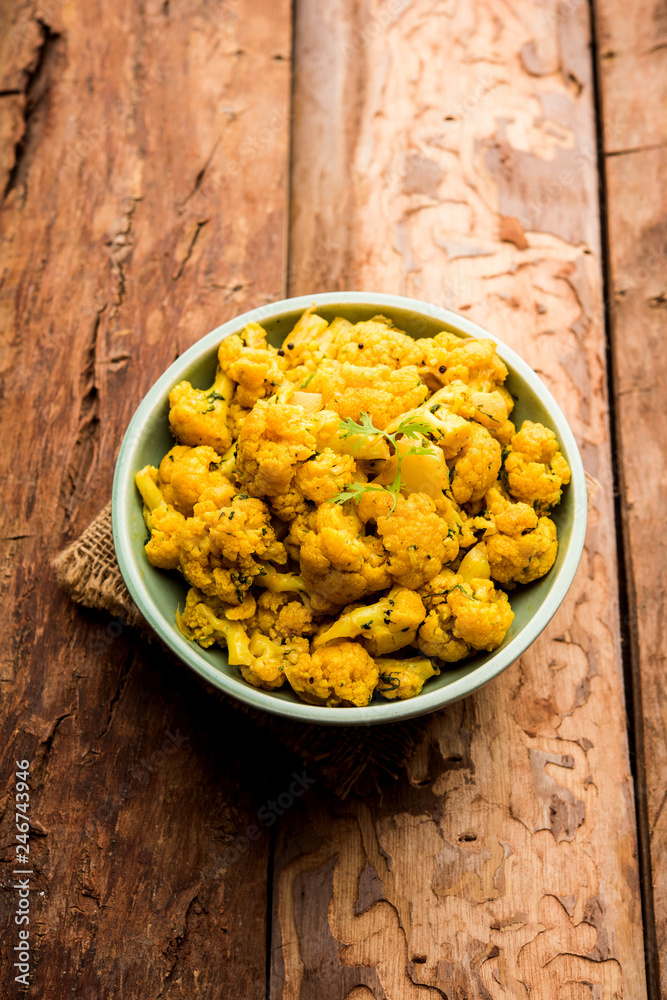 Dry Gobi Masala/ cauliflower Sabzi served in a bowl. selective focus Dry Gobi Masala/ cauliflower Sabzi served in a bowl. selective focus