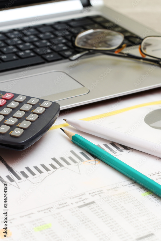 Business concept with a report, money and a calculator Business concept with a report, money and a calculator