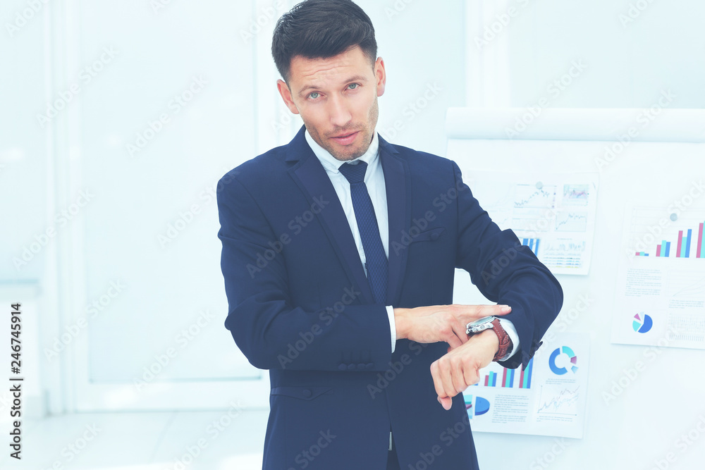 concept - take care of your time. businessman points to his watc concept - take care of your time. businessman points to his watc