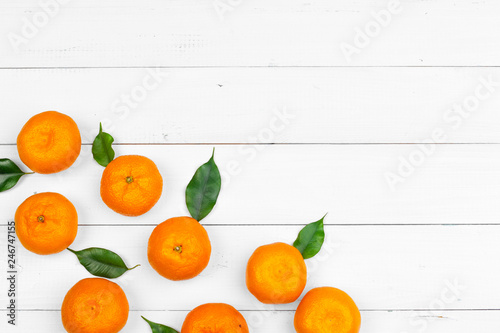 tangerines on a black wooden background, space for text