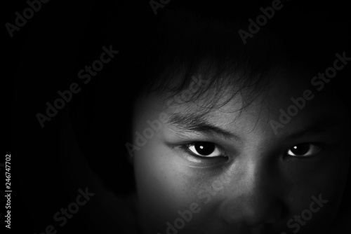 Depress and Hopeless Girl sitting in the dark,imprison, retarded, Child Abuse in white tone photo