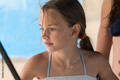 portrait of a beautiful young girl, 9-12 years old, in a swimsuit close-up  Stock Photo | Adobe Stock