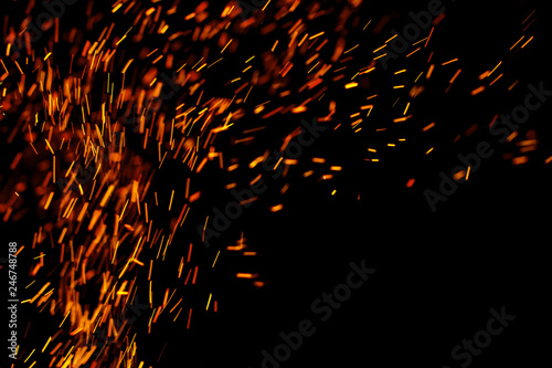 flame of fire with sparks on a black background