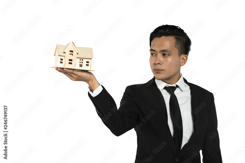 asian man holding a house for mortgage concept asian man holding a house for mortgage concept